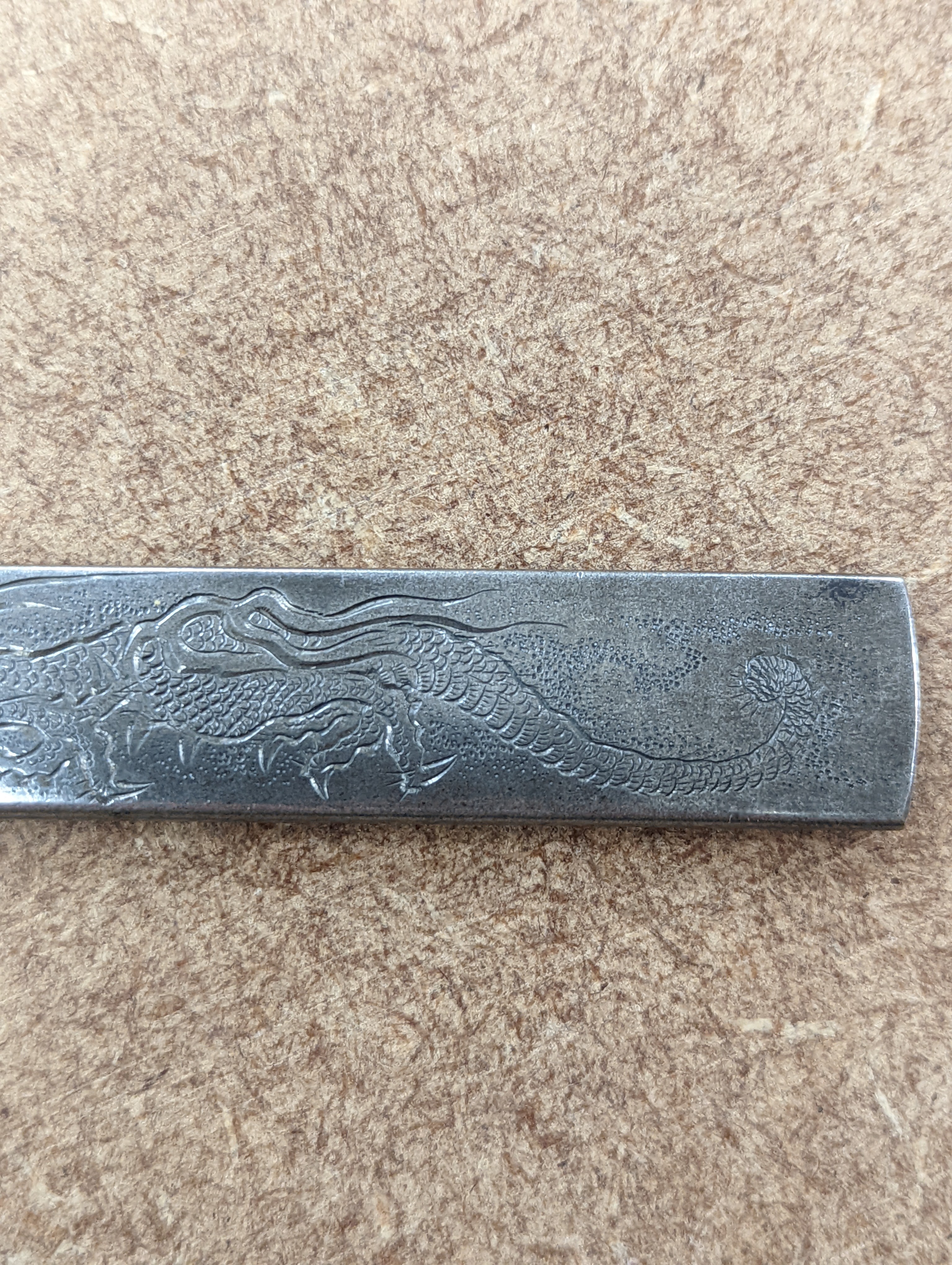 A Japanese mixed metal ‘dragon’ kozuka handle, 19th century, boxed